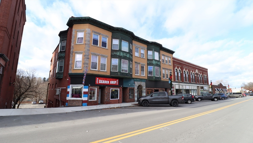 178 High Street, Unit 304 Clinton, MA 01510 - Photo 25 of 26 a front view of a building with street