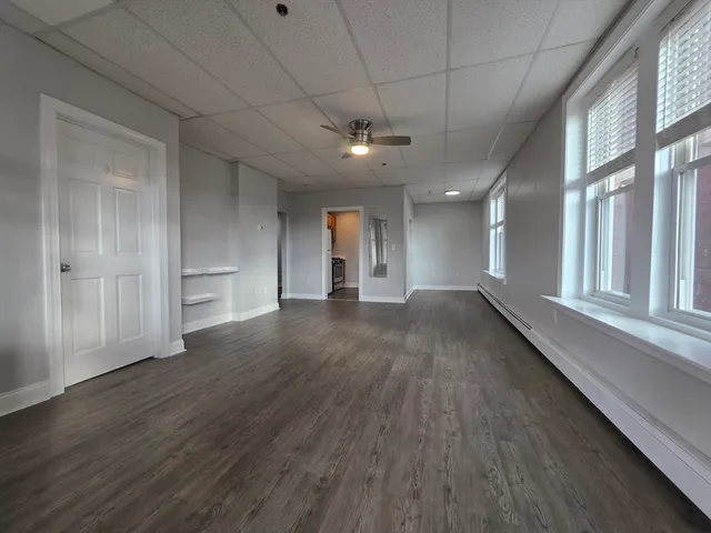 a view of gallery with wooden floor