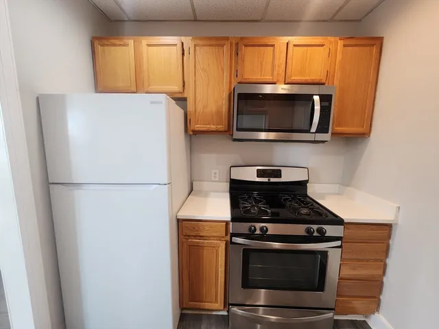 a kitchen with a stove and a microwave