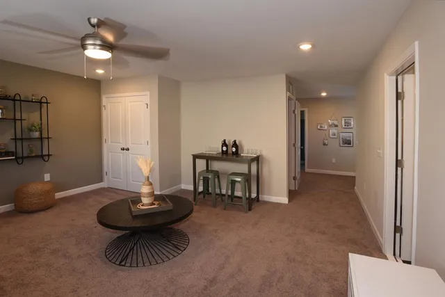 a view of a livingroom with furniture and a chandelier