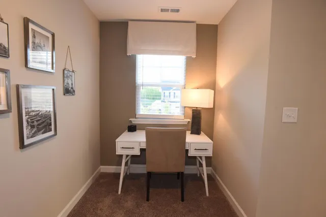 a dining room with a table and a window
