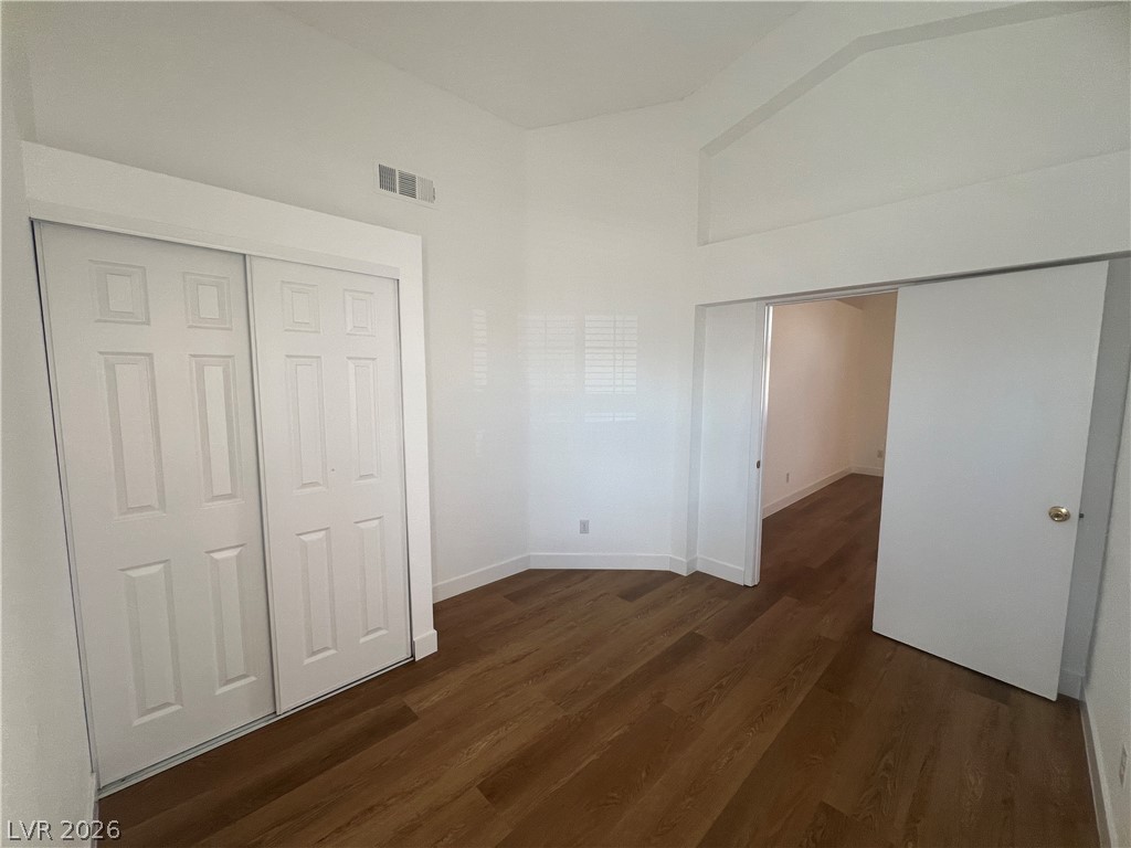 1309 Goldenglow Road Las Vegas, NV 89108 - Photo 9 of 11 Rich hardwood flooring complements the crisp, clean walls of this versatile room.