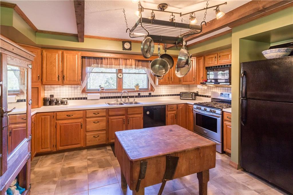 339 Cottage Road Clinton, PA 15026 - Photo 3 of 25 Well equipped kitchen with tile floors. The kitchen island is solid wood butcher block