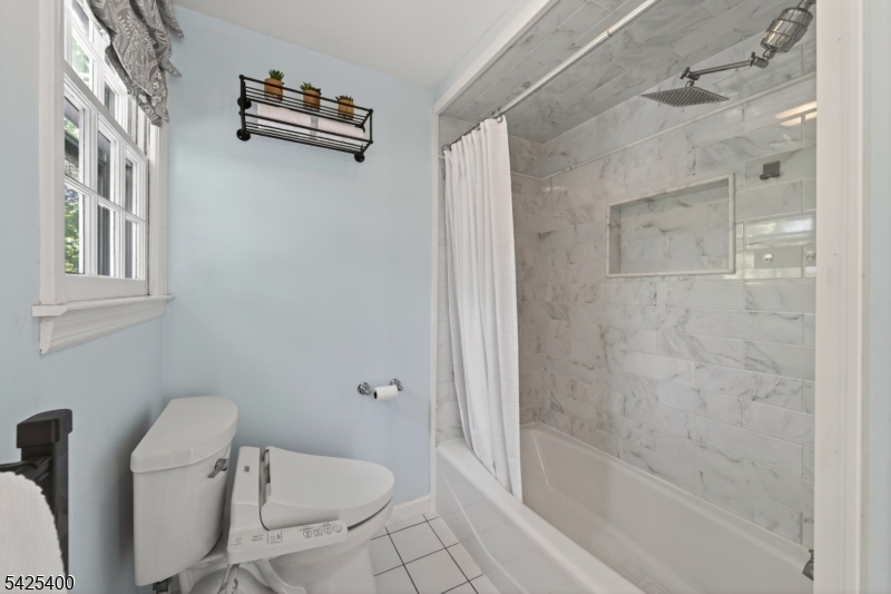 28 Spring Ridge Drive Berkeley Heights, NJ 07922 - Photo 30 of 46 a bathroom with a granite countertop bathtub shower and toilet