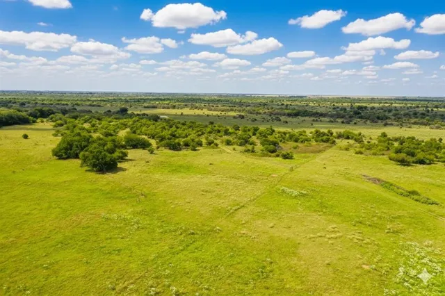 a view of an ocean and a yard