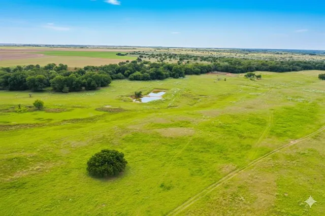 a view of a lake with a yard