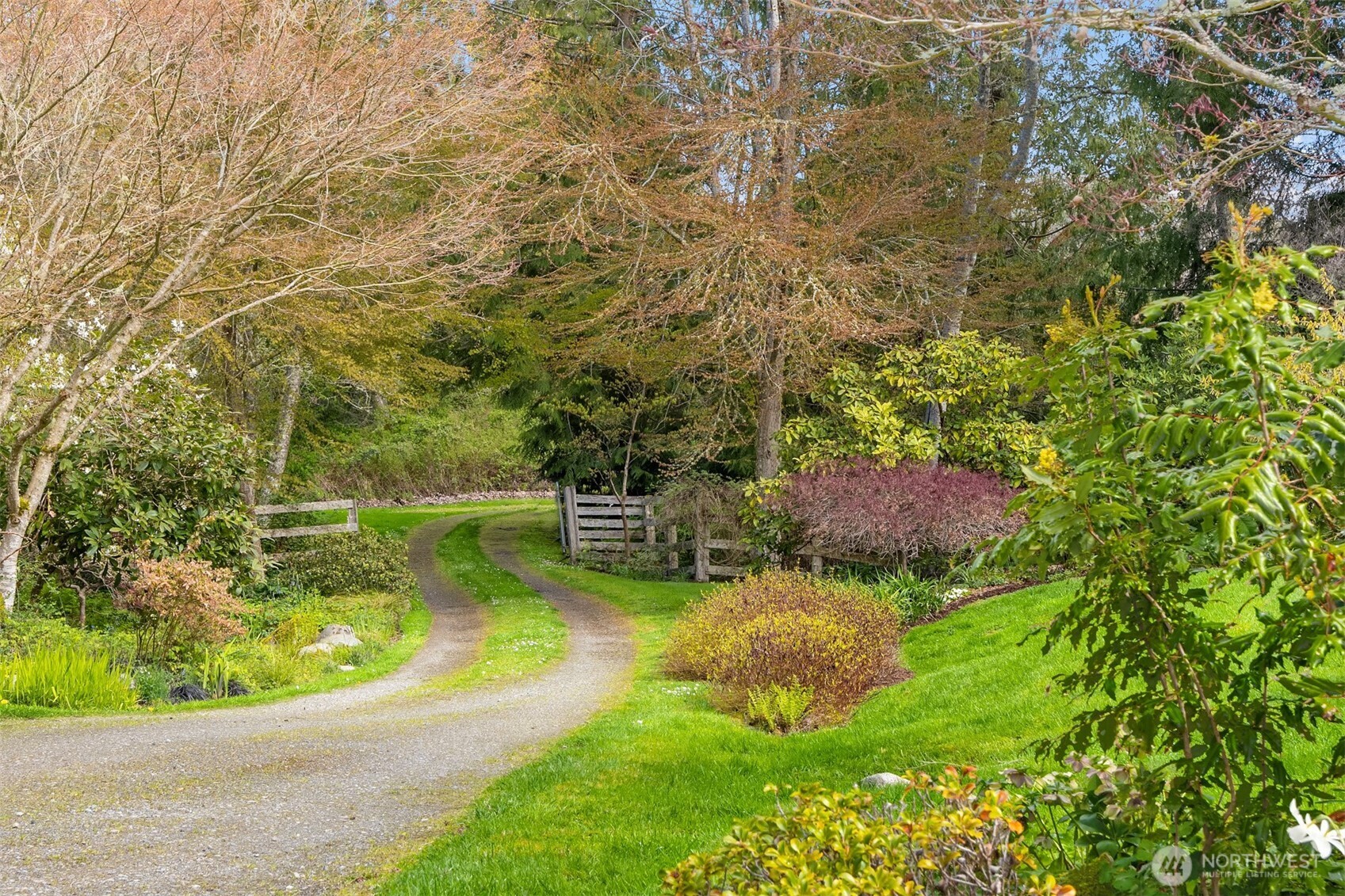 37695 Hansville Road Northeast Hansville, WA 98340 - Photo 31 of 37 a view of a garden with lawn chairs