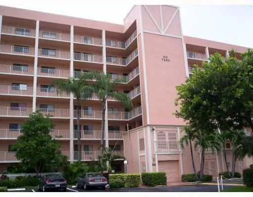 a view of a house with a backyard and a garden