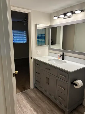 a kitchen with cabinets a refrigerator and a stove