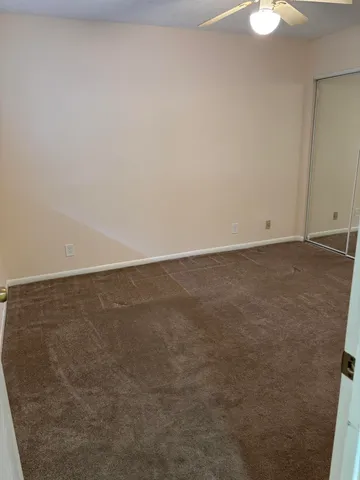 a view of a patio with a table chairs and a table