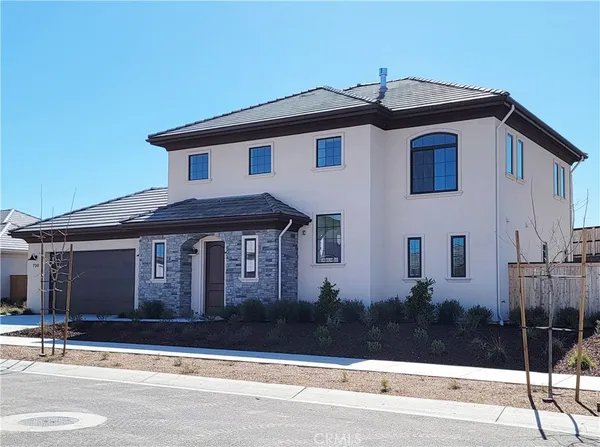 a front view of a house with garage