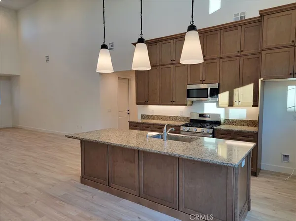 a kitchen with a sink and a stove