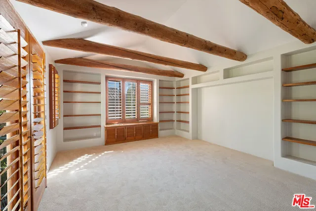 a view of an empty room and a window