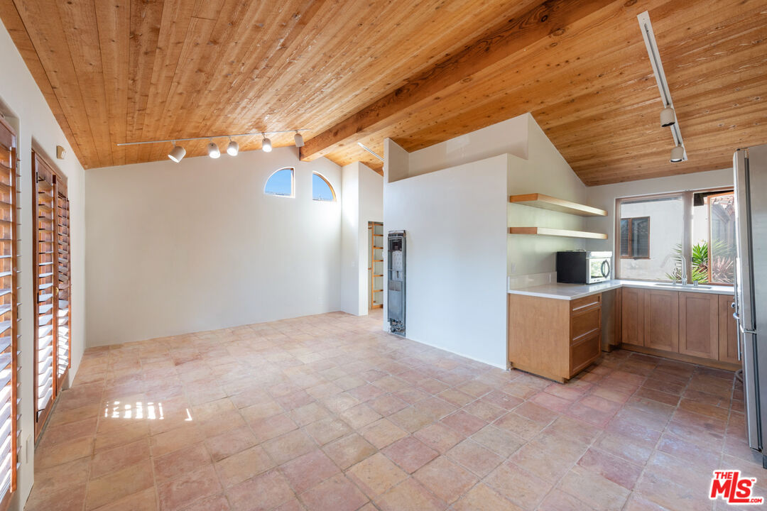 23351 Malibu Colony Road, Unit 108A Malibu, CA 90265 - Photo 24 of 27 a view of a kitchen with a sink and cabinets