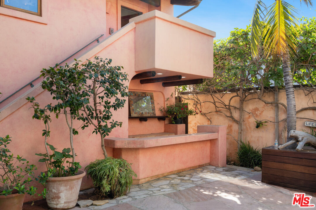 23351 Malibu Colony Road, Unit 108A Malibu, CA 90265 - Photo 6 of 27 a view of a house with potted plants