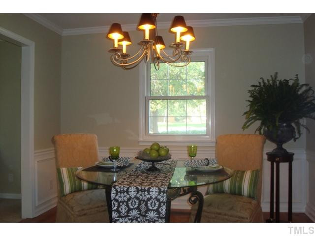 5803 Shamrock Road Durham, NC 27713 - Photo 6 of 20 Formal Dining Room offers Hardwoods and Detailed Trim including Wainscoting Dining Room