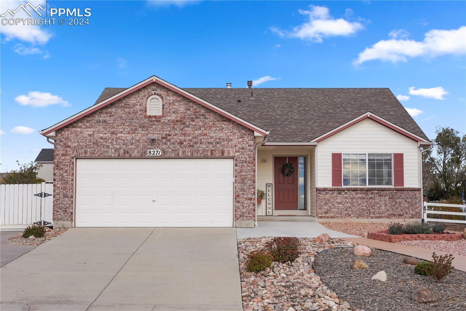 2 car garage, covered front porch and easy to maintain landscaping.