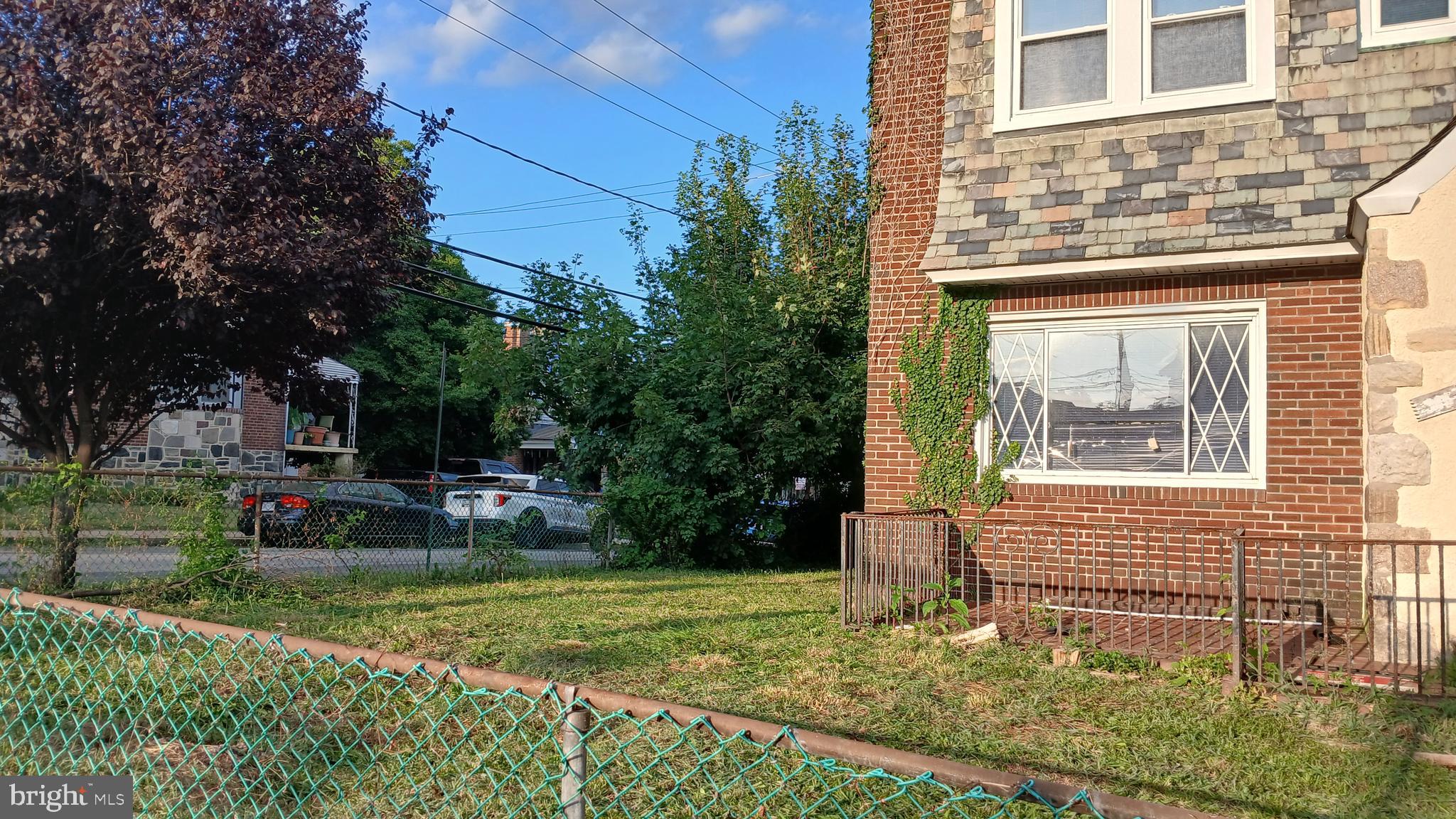 733 Lyndhurst Street Baltimore, MD 21229 - Photo 2 of 8 front view of house with a yard