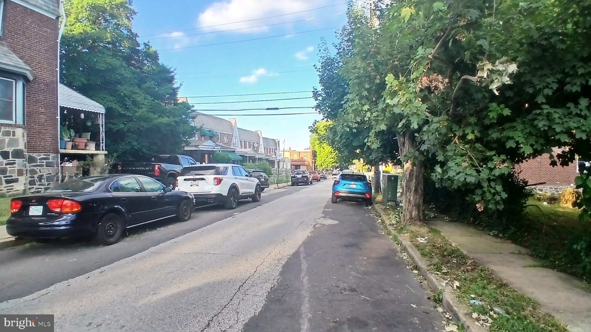 733 Lyndhurst Street Baltimore, MD 21229 - Photo 5 of 8 a cars parked on the side of a street
