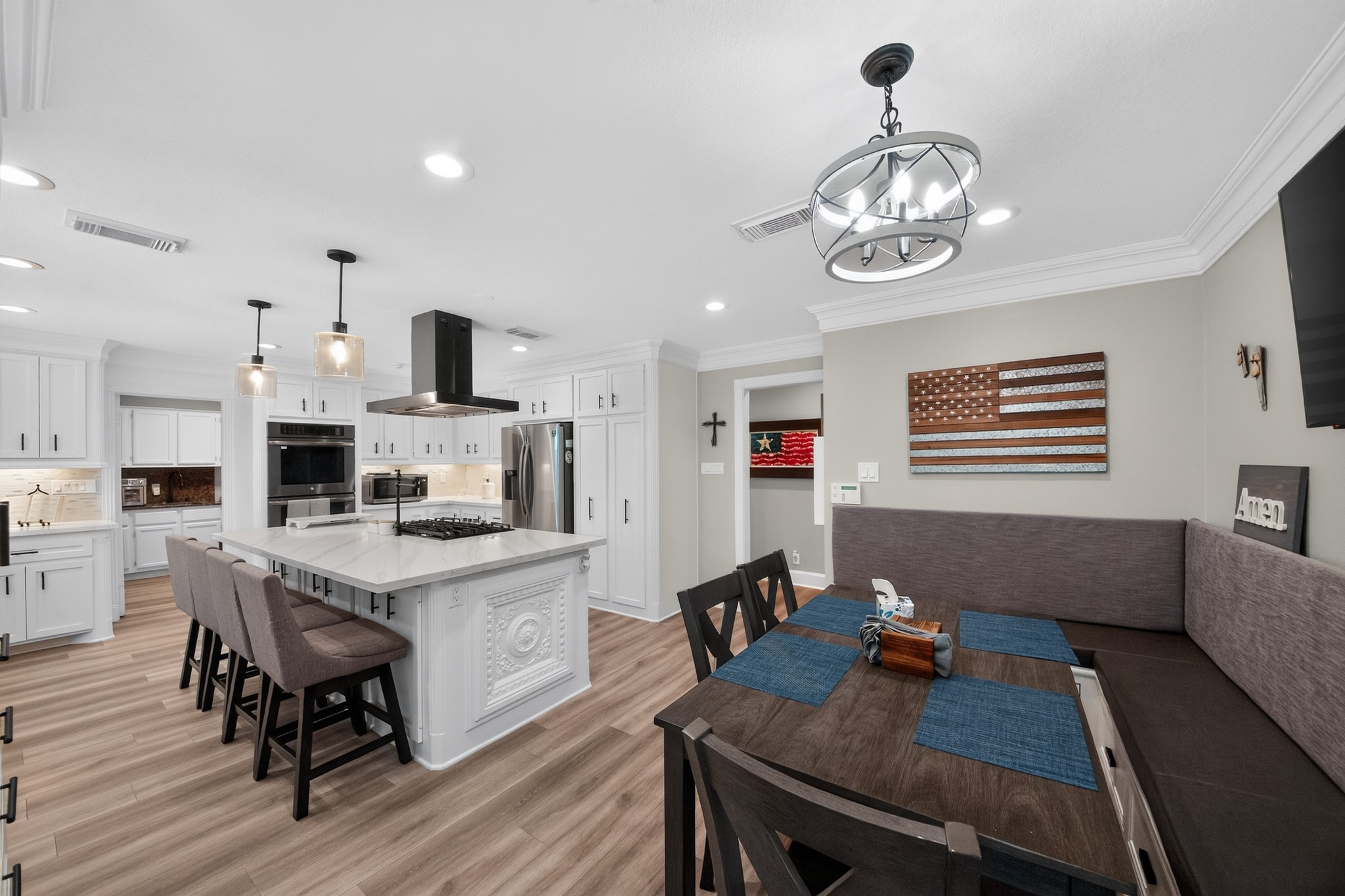 1950 Country Club Road Brenham, TX 77833 - Photo 12 of 39 Culinary adventures await in this naturally illuminated kitchen, featuring a central island and a cozy dining nook.