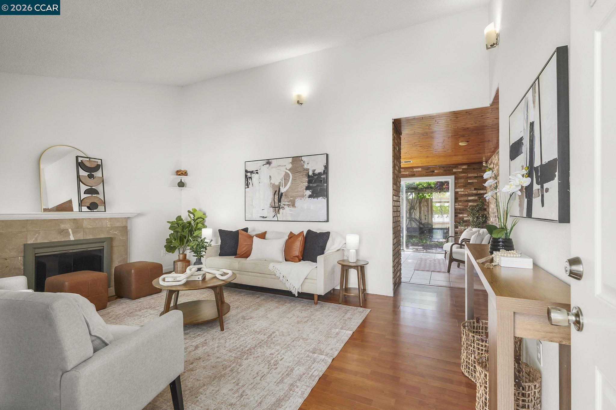 476 Pamela Drive Bay Point, CA 94565 - Photo 9 of 24 a living room with furniture fireplace and wooden floor