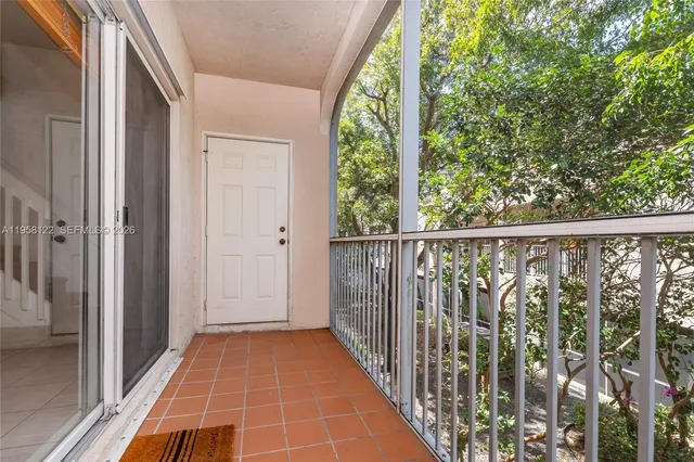 a view of balcony with wooden floor