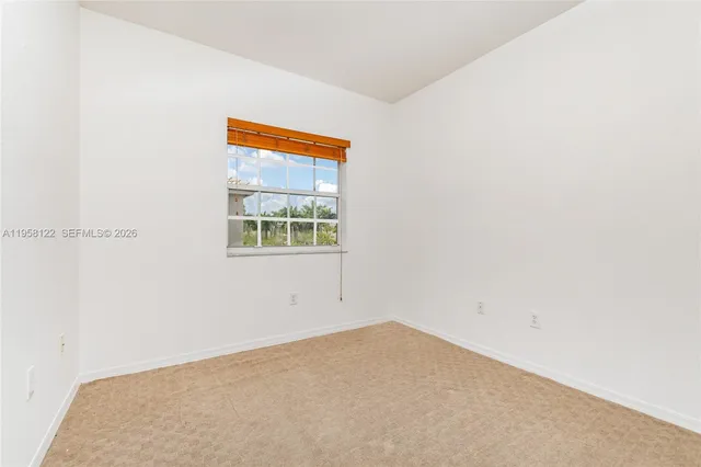 a view of a room that has a window