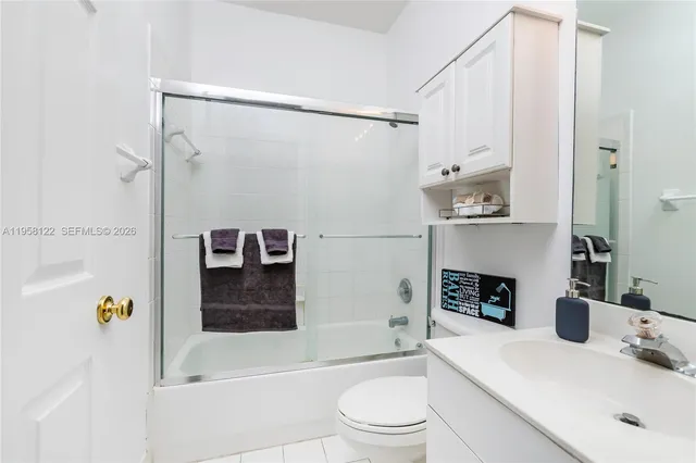 a bathroom with a bath tub a mirror and a shower