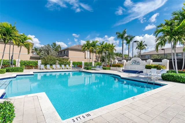 a view of a swimming pool and lounge chair