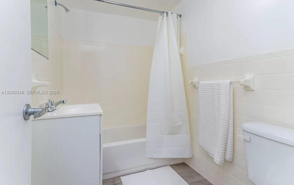 143 Southwest 9th Street, Unit 301 Miami, FL 33130 - Photo 6 of 16 a bathroom with a sink a toilet and shower