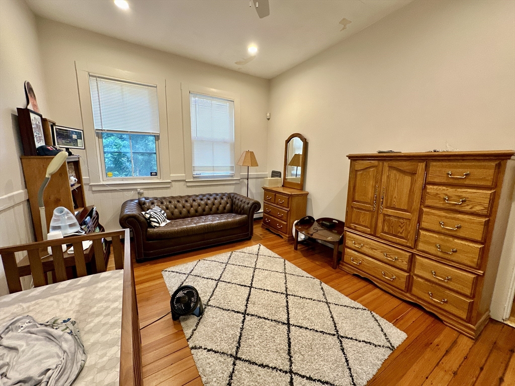 61 Pond Street, Unit 1 Boston, MA 02130 - Photo 13 of 18 a bedroom with furniture and a window