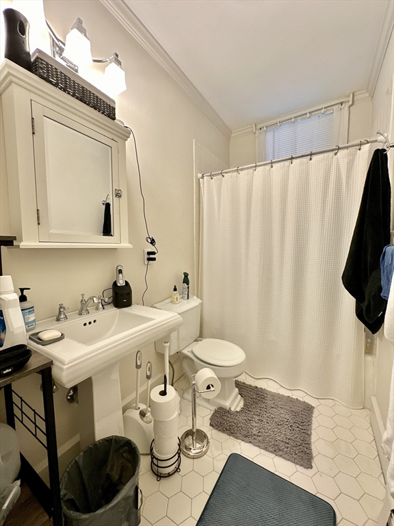 61 Pond Street, Unit 1 Boston, MA 02130 - Photo 15 of 18 a bathroom with a sink toilet and mirror