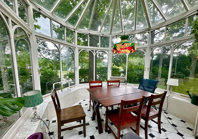 a view of an outdoor space with a table and chairs
