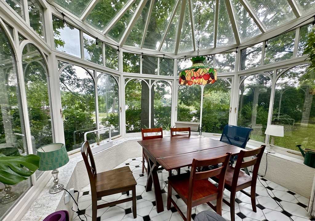 61 Pond Street, Unit 1 Boston, MA 02130 - Photo 16 of 18 a view of an outdoor space with a table and chairs