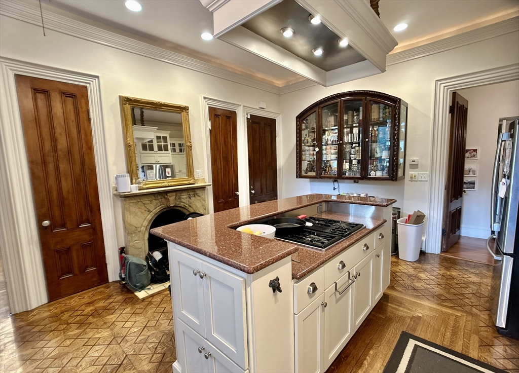 61 Pond Street, Unit 1 Boston, MA 02130 - Photo 3 of 18 a kitchen that has a lot of cabinets in it