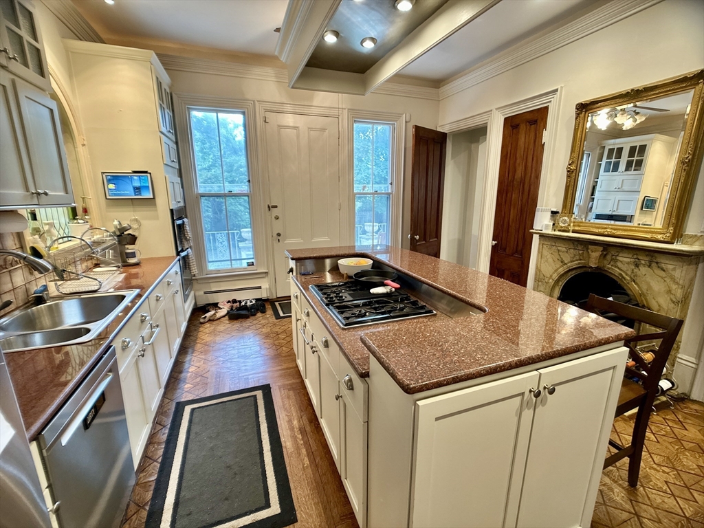 61 Pond Street, Unit 1 Boston, MA 02130 - Photo 4 of 18 a kitchen that has a sink and a stove