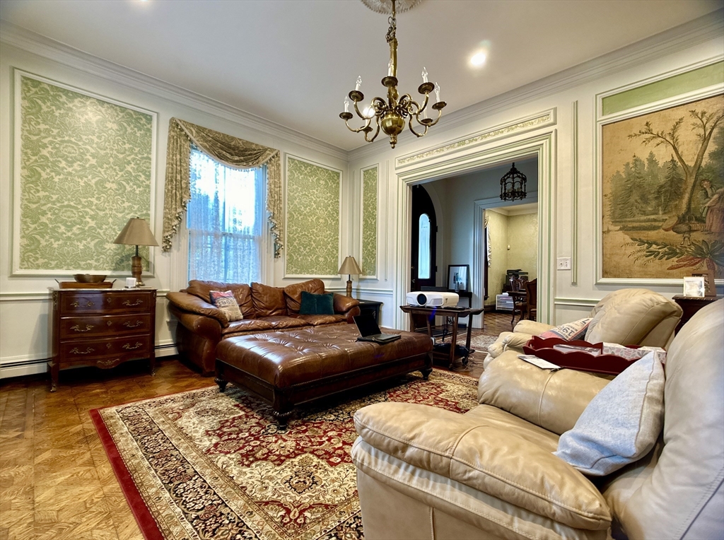 61 Pond Street, Unit 1 Boston, MA 02130 - Photo 7 of 18 a living room with furniture and a large window