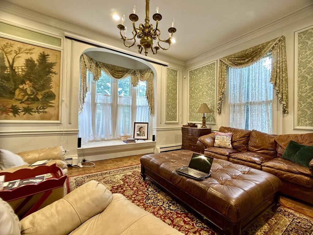 61 Pond Street, Unit 1 Boston, MA 02130 - Photo 8 of 18 a living room with furniture and a large window