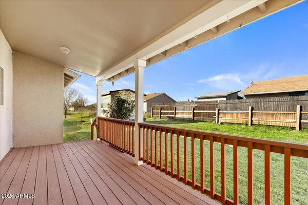 a view of a balcony with wooden floor