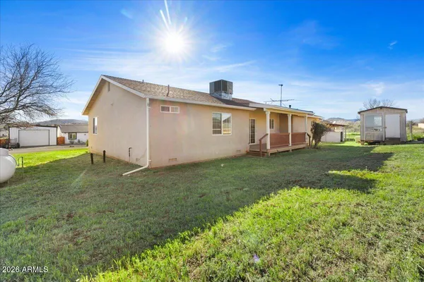 a view of a backyard of the house