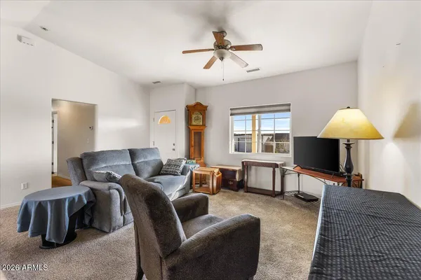 a living room with furniture and a window