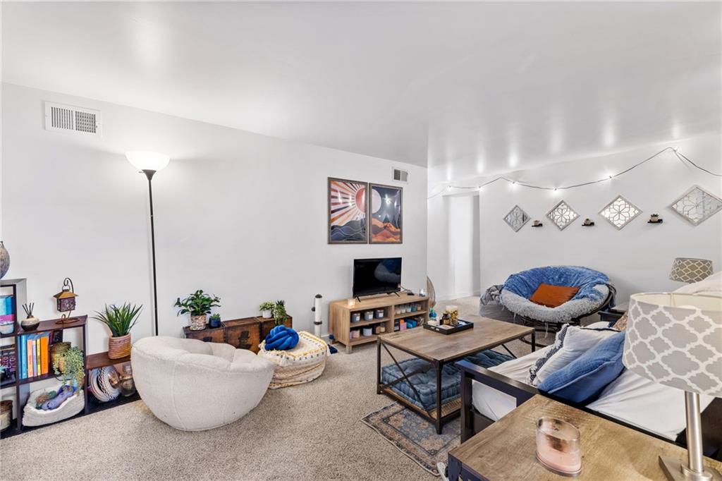 80 South 12th Street Pittsburgh, PA 15203 - Photo 12 of 43 a living room with furniture a rug and a flat screen tv