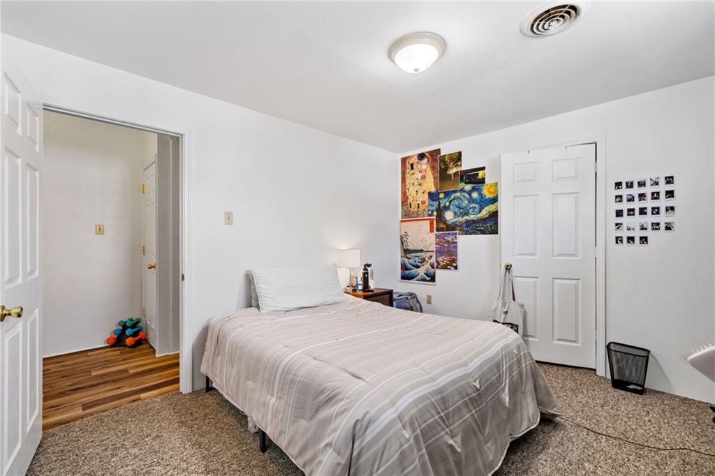 80 South 12th Street Pittsburgh, PA 15203 - Photo 17 of 43 a bedroom with a bed and a couch