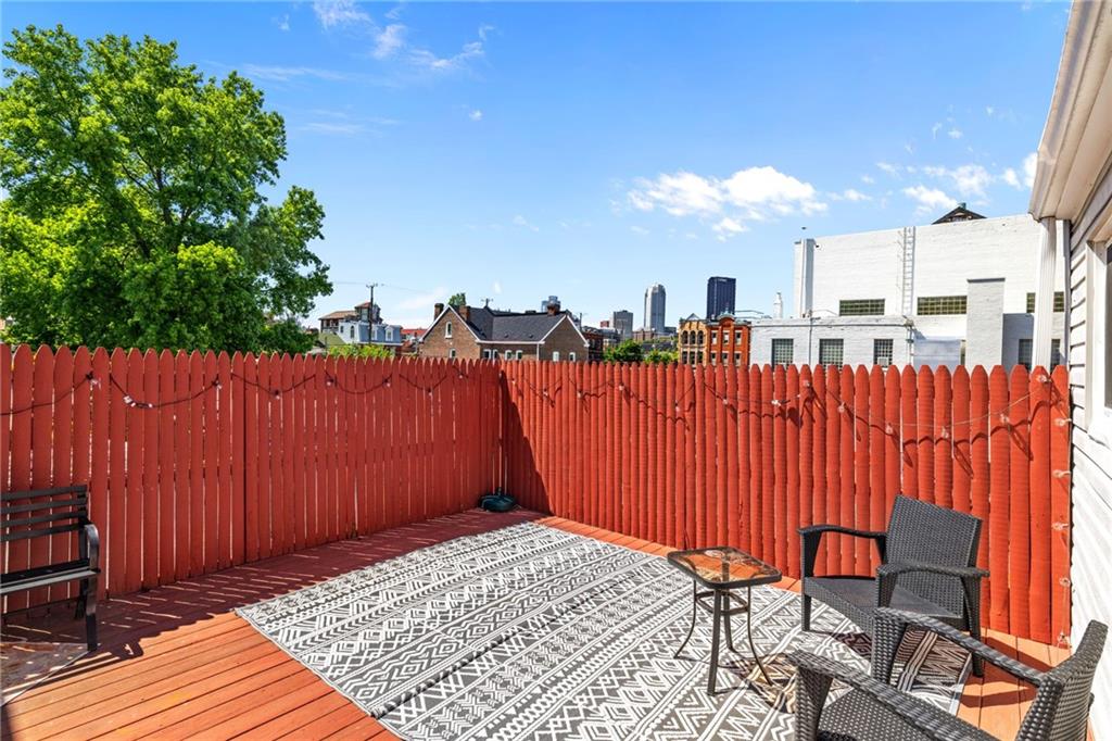 80 South 12th Street Pittsburgh, PA 15203 - Photo 20 of 43 a view of a backyard with a wooden fence