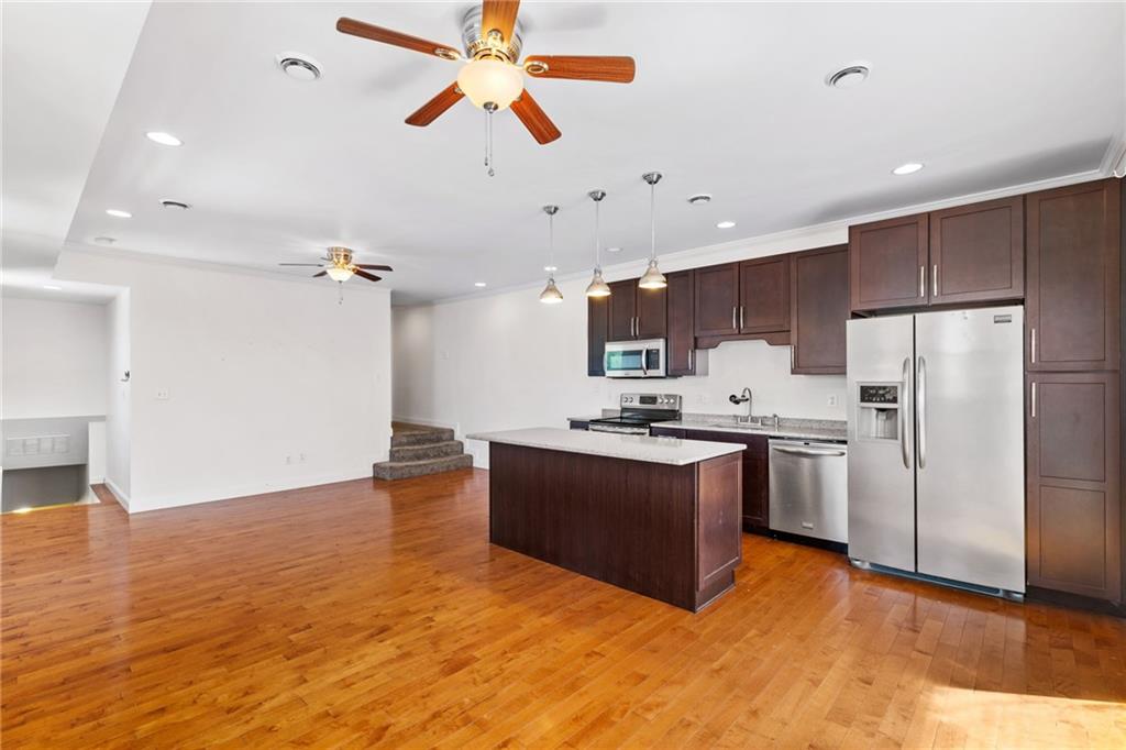 80 South 12th Street Pittsburgh, PA 15203 - Photo 23 of 43 a kitchen with stainless steel appliances a refrigerator and a stove top oven