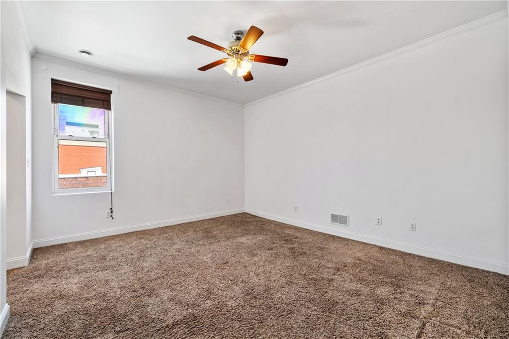 80 South 12th Street Pittsburgh, PA 15203 - Photo 27 of 43 an empty room with ceiling fan and window