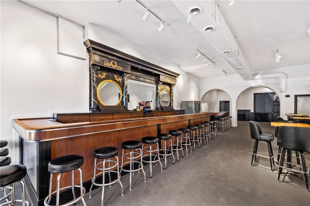 80 South 12th Street Pittsburgh, PA 15203 - Photo 3 of 43 a group of people sitting in living room with a sink