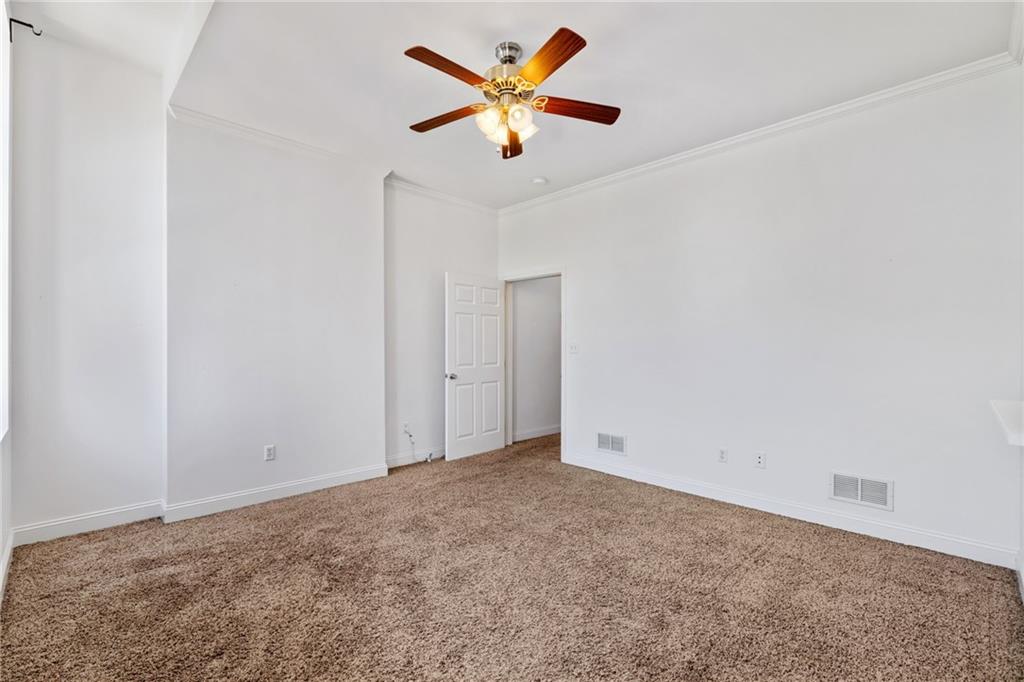 80 South 12th Street Pittsburgh, PA 15203 - Photo 33 of 43 an empty room with closet and a ceiling fan