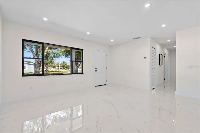 a view of a bathroom with a glass door and a mirror