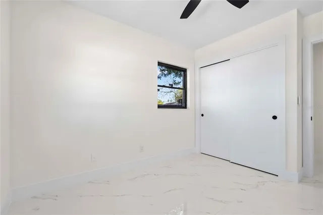 a view of a bathroom with a shower and closet